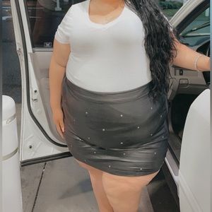 Black faux leather mini skirt with studs